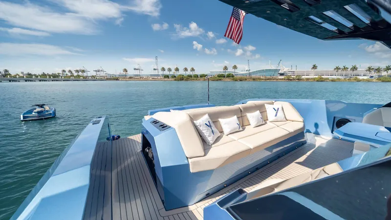 Slide: The Image of Luxurious 2024 Vanquish Yachts VQ58 with spacious deck and scenic waterfront view. - 7