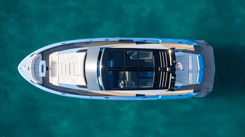 Slide: The Image of Aerial view of 2024 Vanquish Yachts VQ58 on turquoise water. - 3