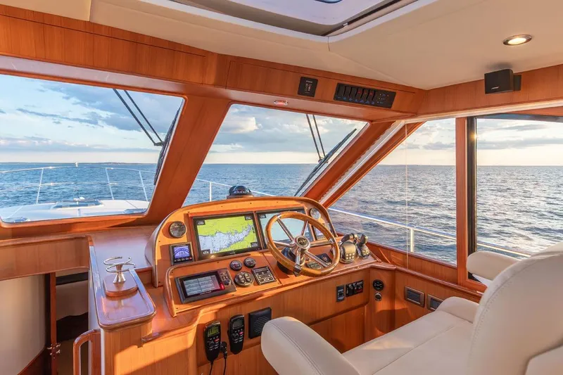 Slide: The Image of Helm of 2014 Hunt Yachts 44, featuring navigation equipment and ocean view. - 16
