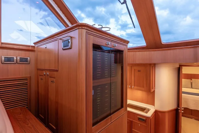 Slide: The Image of Luxurious interior of 2014 Hunt Yachts 44, featuring elegant wood cabinetry and modern design. - 24