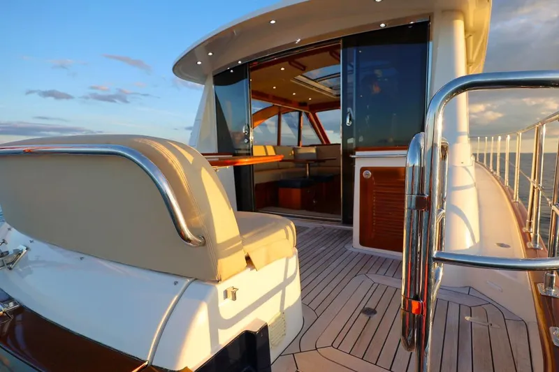 Slide: The Image of Luxurious 2014 Hunt Yachts 44 with elegant deck and seating at sunset. - 11