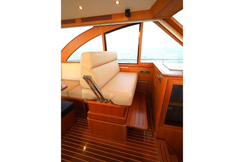 Slide: The Image of Luxurious interior of 2014 Hunt Yachts 44, featuring elegant wood finish and comfortable seating. - 20