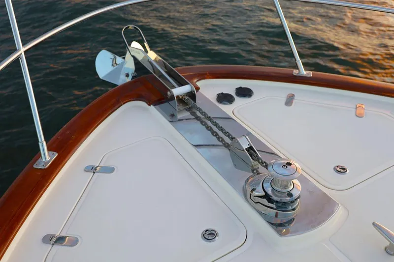 Slide: The Image of Bow of 2014 Hunt Yachts 44 with anchor and winch, on calm water. - 6