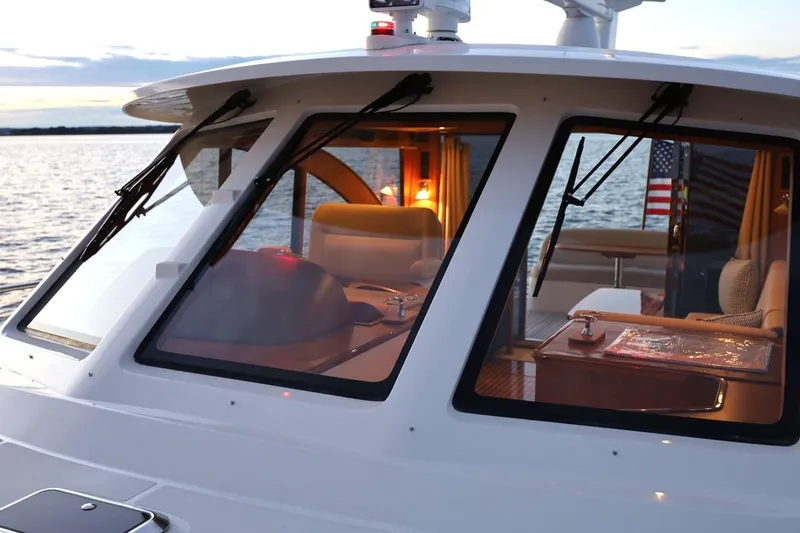 Slide: The Image of 2014 Hunt Yachts 44, elegant interior view, sunset on the water. - 7