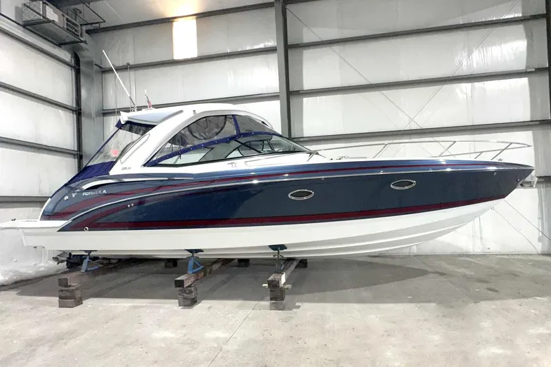 The Image of 2022 Formula 350 Sun Sport boat in storage, showcasing sleek design and modern features. - 0