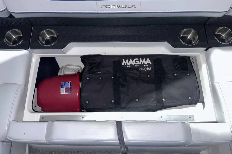 Slide: The Image of Storage compartment in 2022 Formula 350 Sun Sport boat with Magma grill bag. - 10