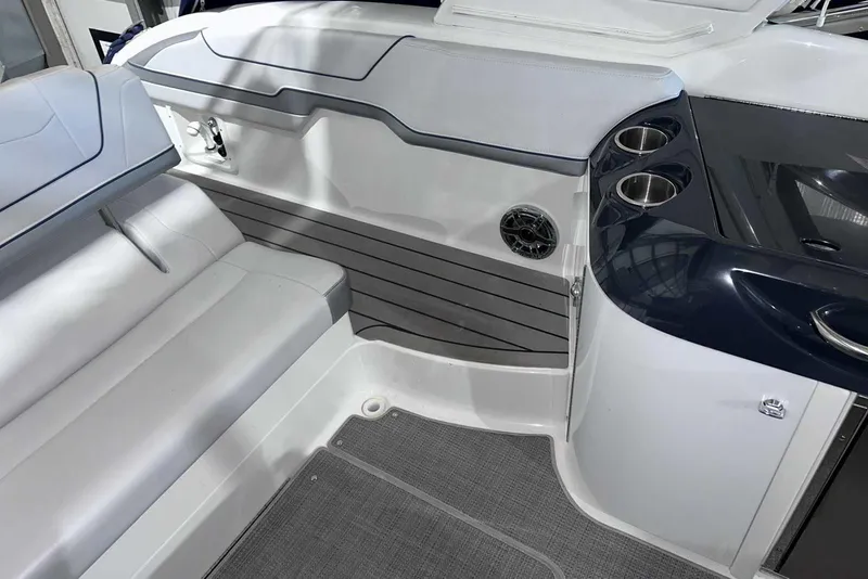 Slide: The Image of 2022 Formula 350 Sun Sport boat interior with seating and cup holders. - 17
