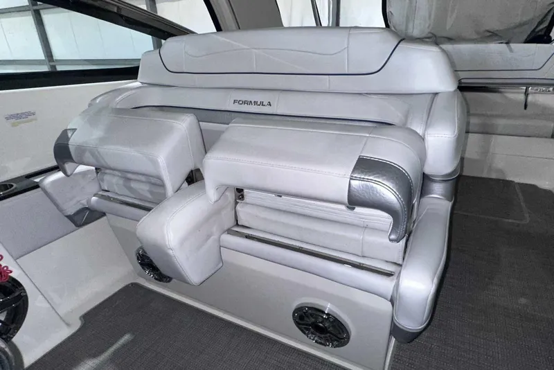 Slide: The Image of 2022 Formula 350 Sun Sport interior seating with luxurious white upholstery and sleek design. - 22