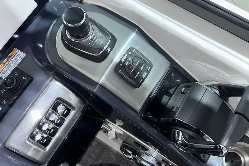 Slide: The Image of Control panel of 2022 Formula 350 Sun Sport boat with joystick and switches. - 27