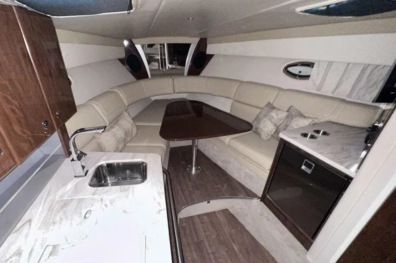 Slide: The Image of Luxurious interior of 2022 Formula 350 Sun Sport yacht with seating and kitchenette. - 29