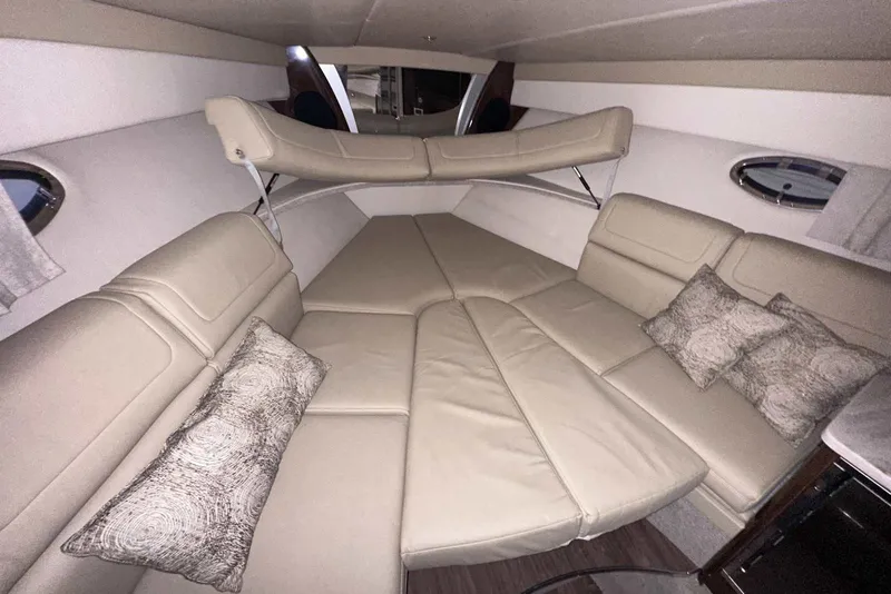 Slide: The Image of Interior of 2022 Formula 350 Sun Sport boat with beige seating and decorative pillows. - 30