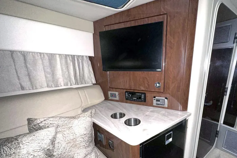 Slide: The Image of Interior of 2022 Formula 350 Sun Sport with TV, seating, and countertop. - 32