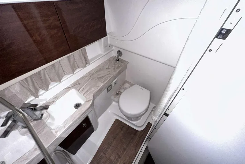 Slide: The Image of 2022 Formula 350 Sun Sport bathroom with modern fixtures and wood accents. - 37