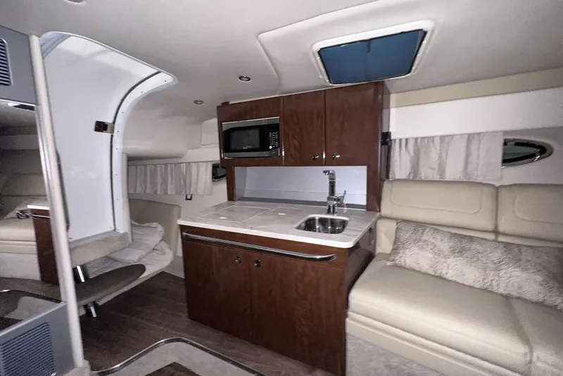 Slide: The Image of 2022 Formula 350 Sun Sport cabin interior with kitchenette and seating area. - 38