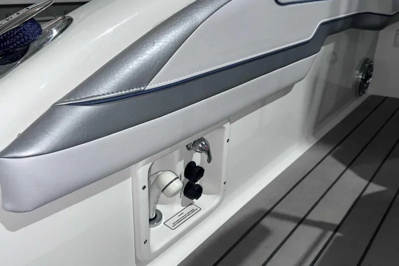 Slide: The Image of 2022 Formula 350 Sun Sport boat interior detail with sleek upholstery and control panel. - 7