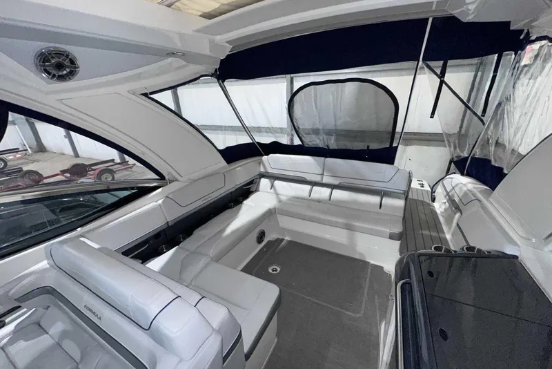 Slide: The Image of 2022 Formula 350 Sun Sport boat interior with spacious seating and modern design. - 9