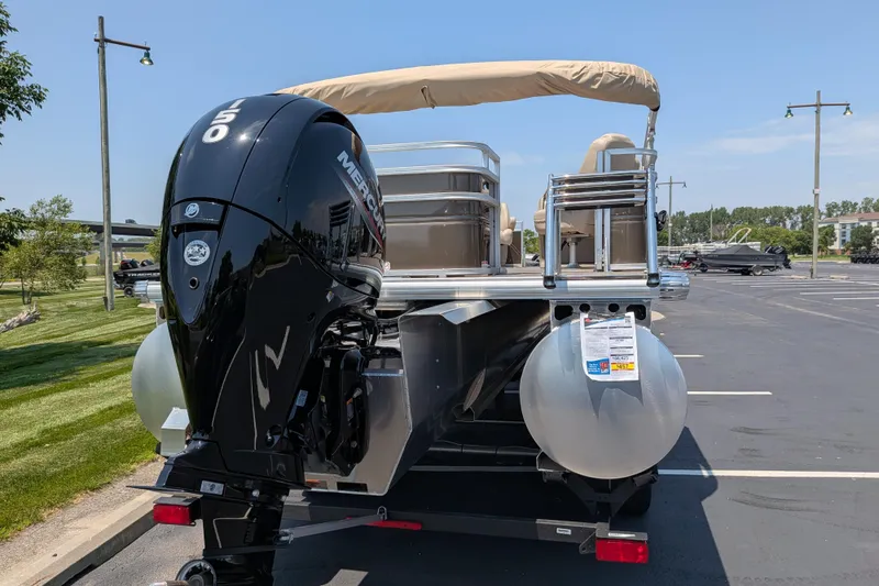 Slide: The Image of 2025 Sun Tracker Sportfish 24 XP3 pontoon boat with Mercury 150 engine in parking lot. - 67