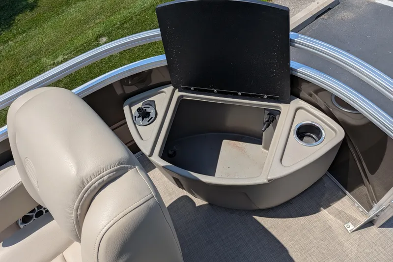 Slide: The Image of Interior view of 2025 Sun Tracker Sportfish 24 XP3 boat with seating and storage compartment. - 60