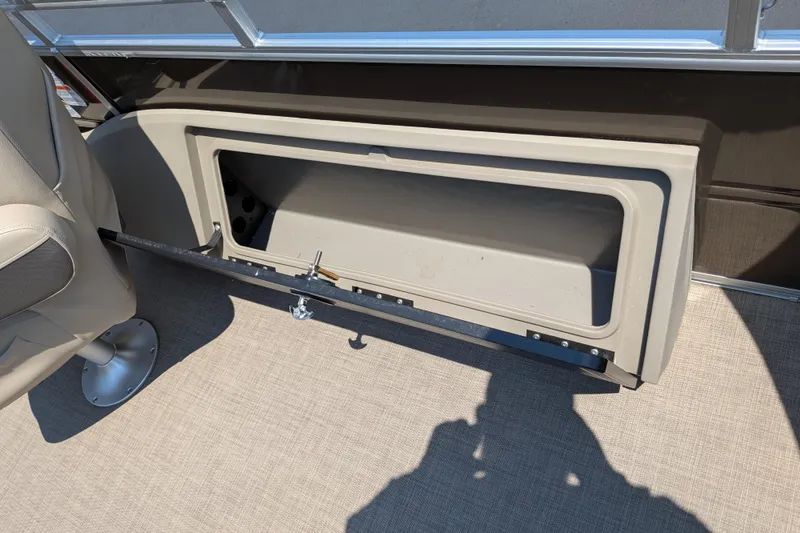 Slide: The Image of Open storage compartment on 2025 Sun Tracker Sportfish 24 XP3 boat interior. - 64