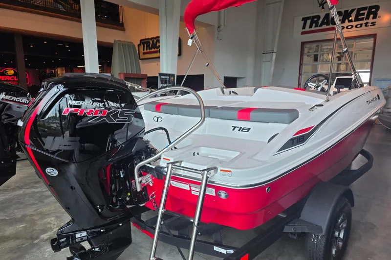 Slide: The Image of 2026 Tahoe T18 boat with Mercury Pro XS engine in showroom. - 2