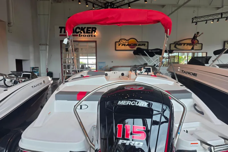 Slide: The Image of 2026 Tahoe T18 boat with Mercury 115 Pro engine in showroom display. - 3