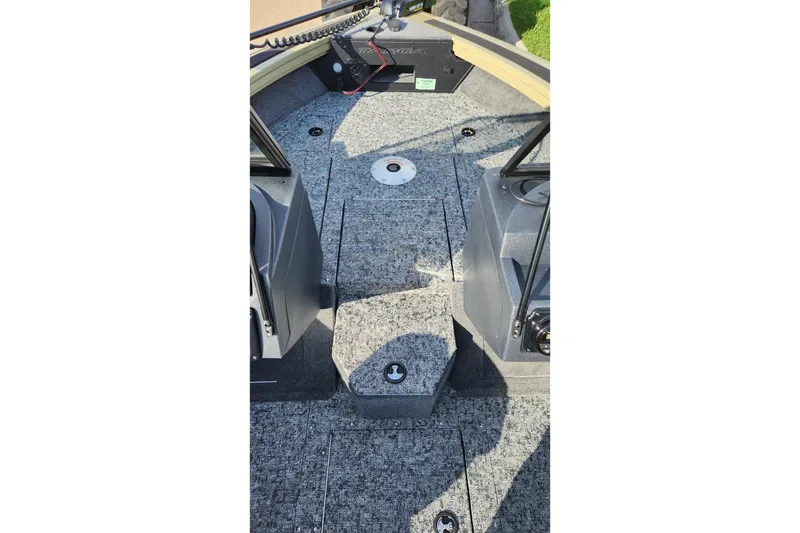 Slide: The Image of 2026 Tracker Targa V-19 Combo boat interior with swivel seat and dual windshields. - 12