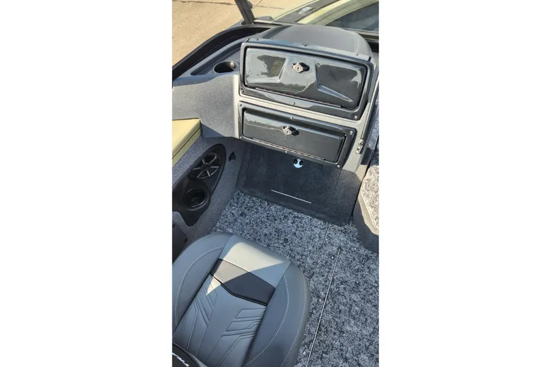 Slide: The Image of 2026 Tracker Targa V-19 Combo boat on trailer, parked on pavement under a cloudy sky. - 5