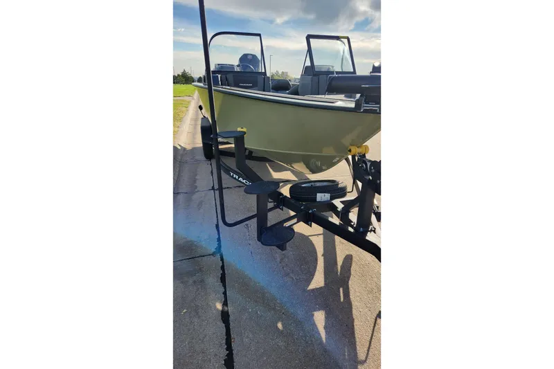 Slide: The Image of 2026 Tracker Targa V-19 Combo boat interior with steering wheel and seat. - 8