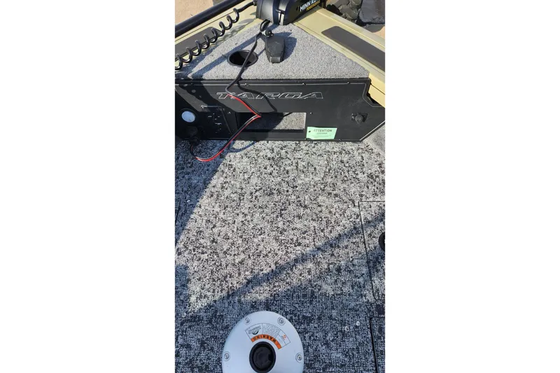 Slide: The Image of 2026 Tracker Targa V-19 Combo boat interior with Minn Kota trolling motor. - 9