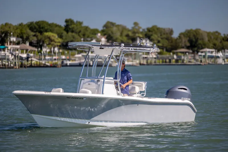 The Image of 2020 Sea Hunt Triton 210 boat cruising on a sunny day with a Yamaha engine. - 0