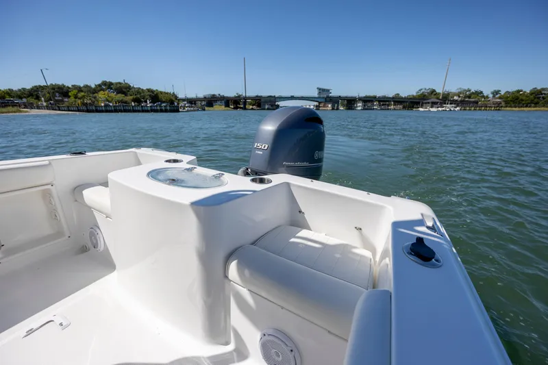 Slide: The Image of 2020 Sea Hunt Triton 210 boat with Yamaha engine on calm water. - 11