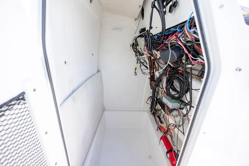 Slide: The Image of Interior wiring of a 2020 Sea Hunt Triton 210 boat, showcasing organized cables. - 20