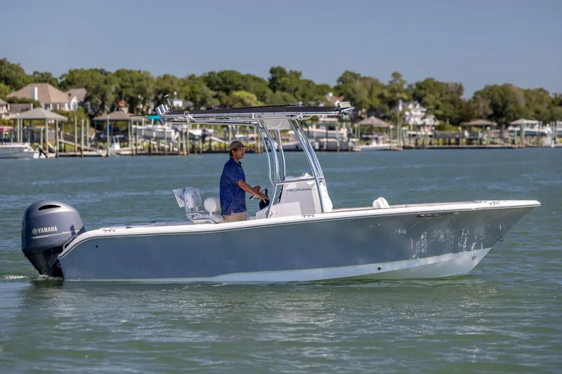 Slide: The Image of 2020 Sea Hunt Triton 210 boat cruising on a sunny day with a Yamaha engine. - 8