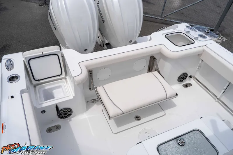 Slide: The Image of 2026 Sea Hunt Gamefish 27 Coffin Box boat interior with seating and storage compartments. - 10