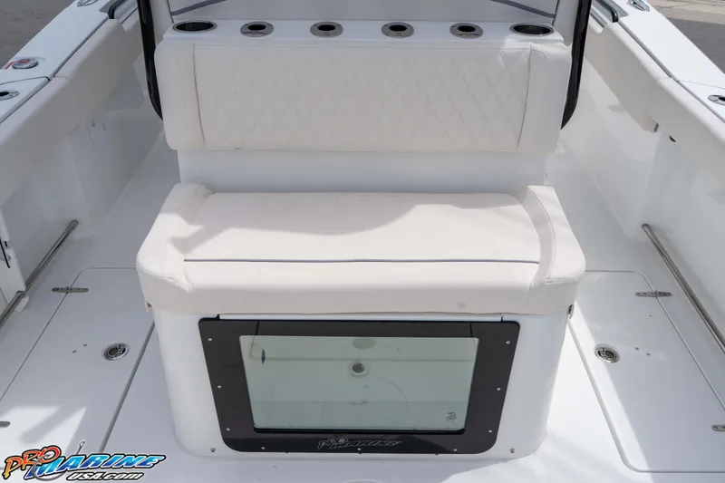 Slide: The Image of 2026 Sea Hunt Gamefish 27 Coffin Box interior with cushioned seating and storage. - 11