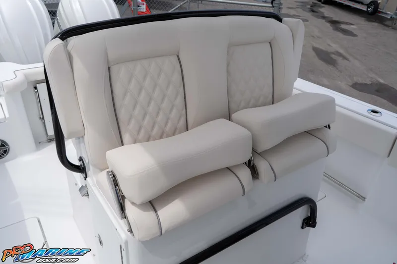 Slide: The Image of 2026 Sea Hunt Gamefish 27 Coffin Box boat seating with cushioned armrests. - 15