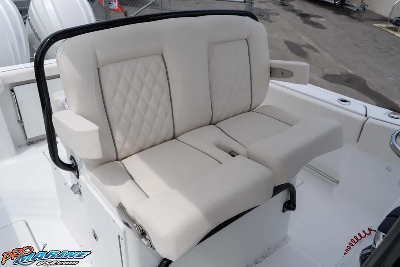 Slide: The Image of 2026 Sea Hunt Gamefish 27 Coffin Box boat seating, featuring plush white upholstery. - 16