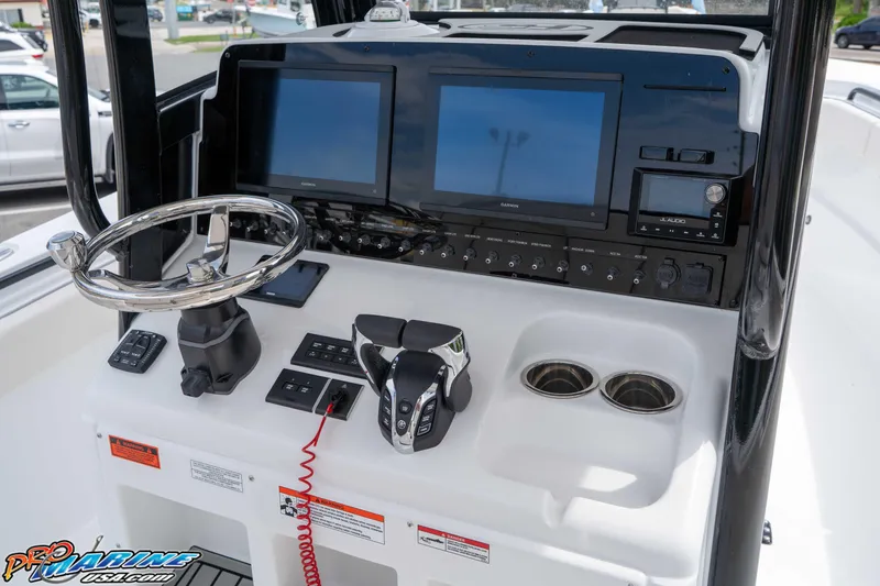 Slide: The Image of 2026 Sea Hunt Gamefish 27 Coffin Box helm with dual screens and modern controls. - 18