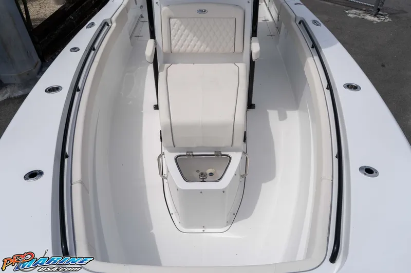 Slide: The Image of 2026 Sea Hunt Gamefish 27 Coffin Box boat interior with seating and storage. - 23