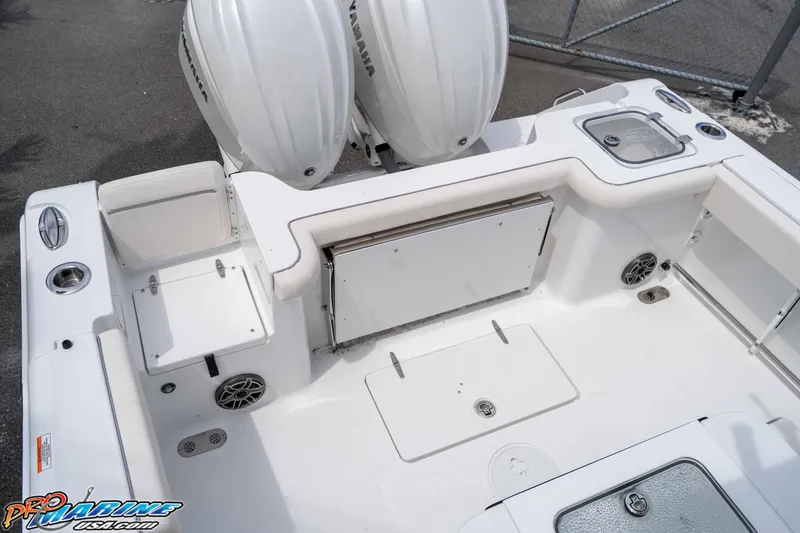 Slide: The Image of 2026 Sea Hunt Gamefish 27 Coffin Box boat deck with dual Yamaha engines. - 9