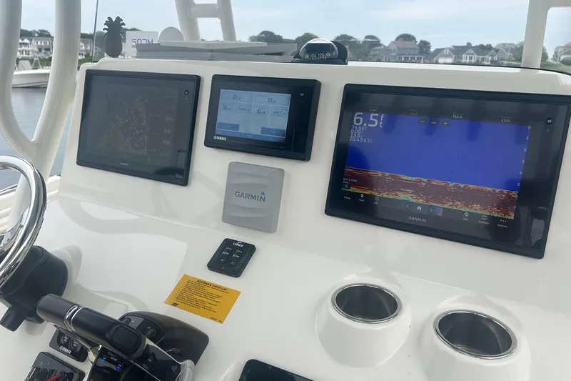 Slide: The Image of Key West Billistic 261 Center Console 2020 dashboard with Garmin navigation displays. - 15