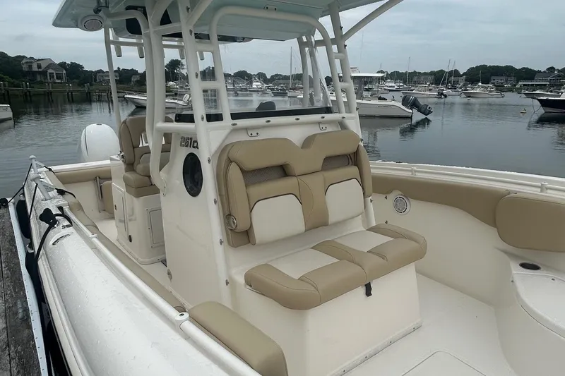 Slide: The Image of 2020 Key West Billistic 261 Center Console boat docked in a marina. - 4