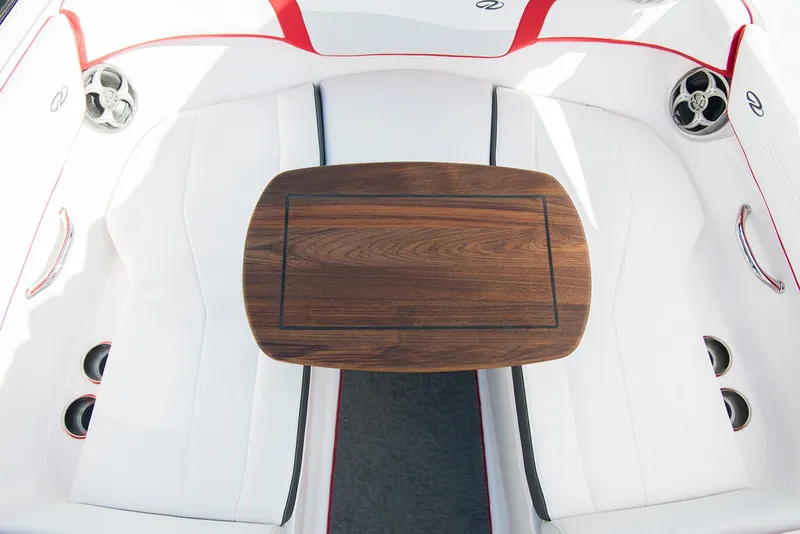 Slide: The Image of 2022 Regal 23 OBX boat storage compartment with cup holders and speaker. - 12