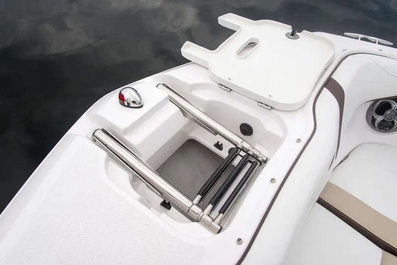 Slide: The Image of Open storage compartment in 2022 Regal 23 OBX boat, featuring hydraulic lift support. - 14