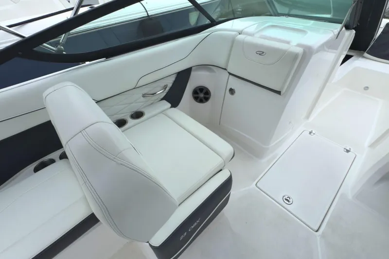 Slide: The Image of 2022 Regal 23 OBX boat interior with white seating and sleek design. - 16