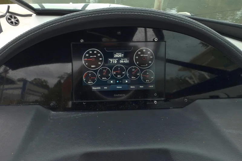Slide: The Image of Dashboard of 2022 Regal 23 OBX boat with Garmin display showing gauges. - 21