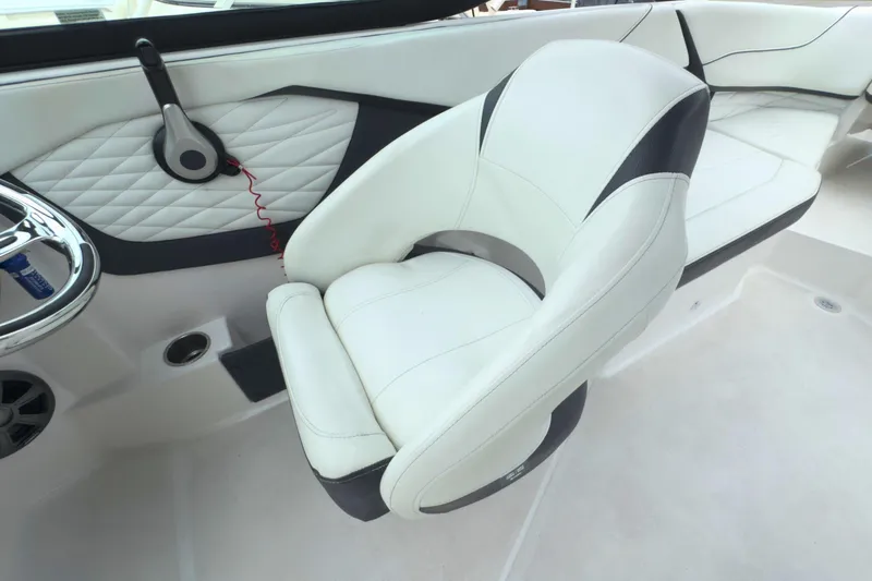 Slide: The Image of Luxury seating in 2022 Regal 23 OBX boat, featuring white and black upholstery. - 26