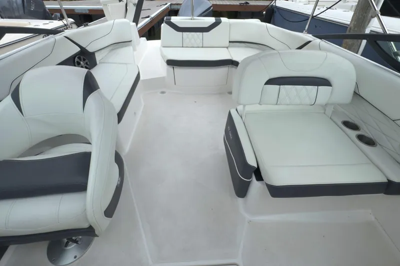 Slide: The Image of Luxurious interior of 2022 Regal 23 OBX boat with white and gray seating. - 27