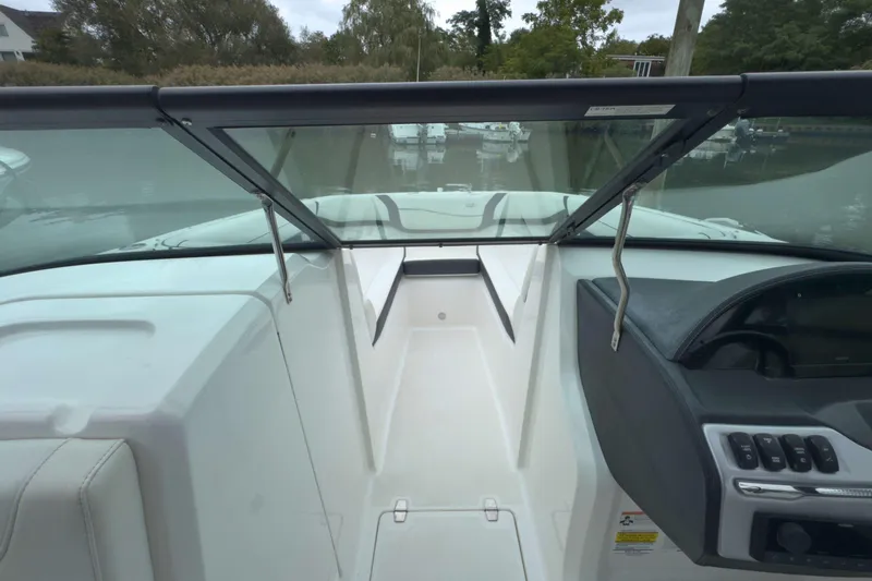 Slide: The Image of 2022 Regal 23 OBX boat interior with windshield and dashboard view. - 29