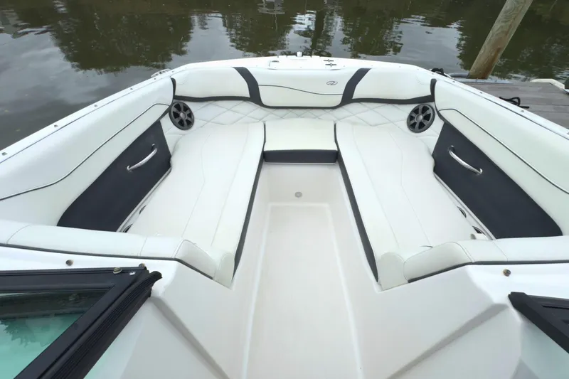Slide: The Image of 2022 Regal 23 OBX boat interior with white seating and sleek design. - 30
